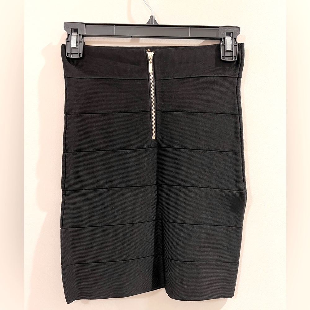 Bebe body con skirt with gold zipper detail in back